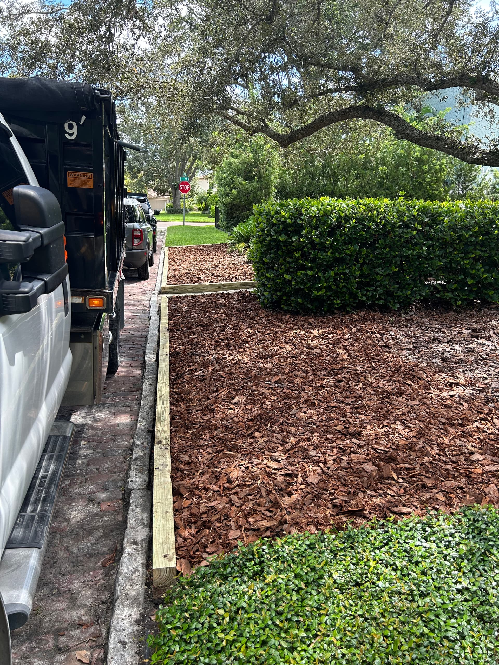 Gallery photos for Enhancing Curb Appeal with New Wooden Borders and Fresh Mulch Installation: Image #3