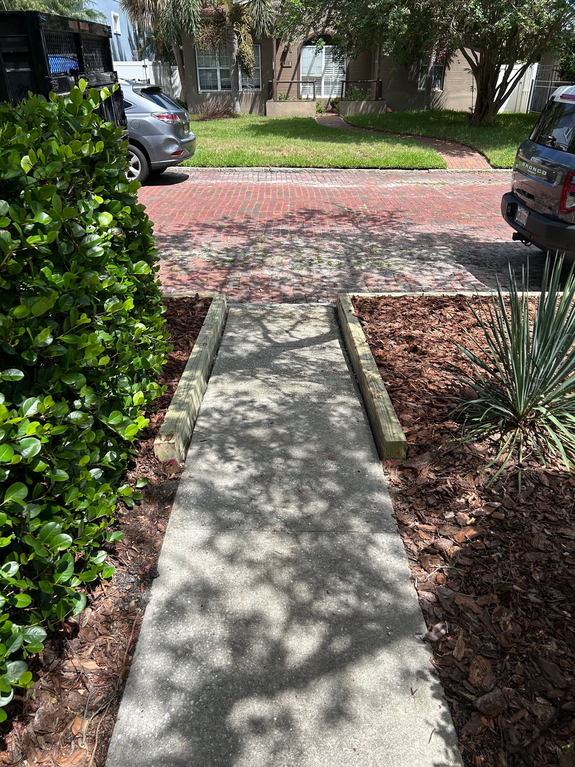 Gallery photos for Enhancing Curb Appeal with New Wooden Borders and Fresh Mulch Installation: Image #2